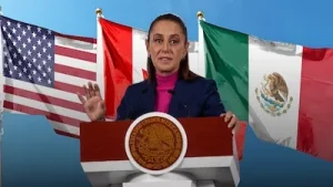 Claudia Sheinbaum en podio con banderas de Mexico y Estados Unidos